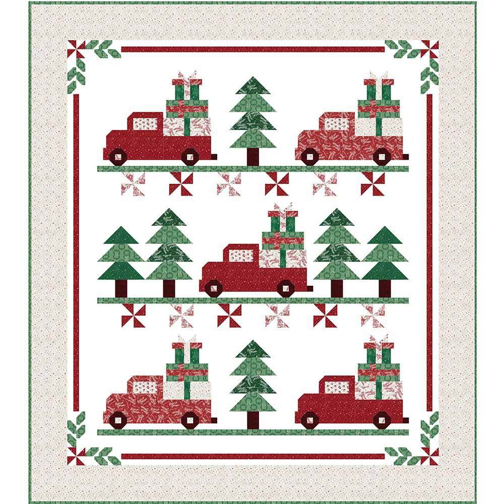 Vintage Christmas quilt with trees and red trucks with presents