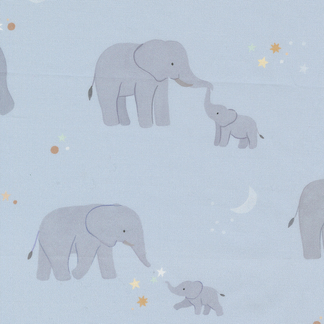 fabric swatch with simple drawings of mother and baby elephants and light pastel stars on a soft blue background