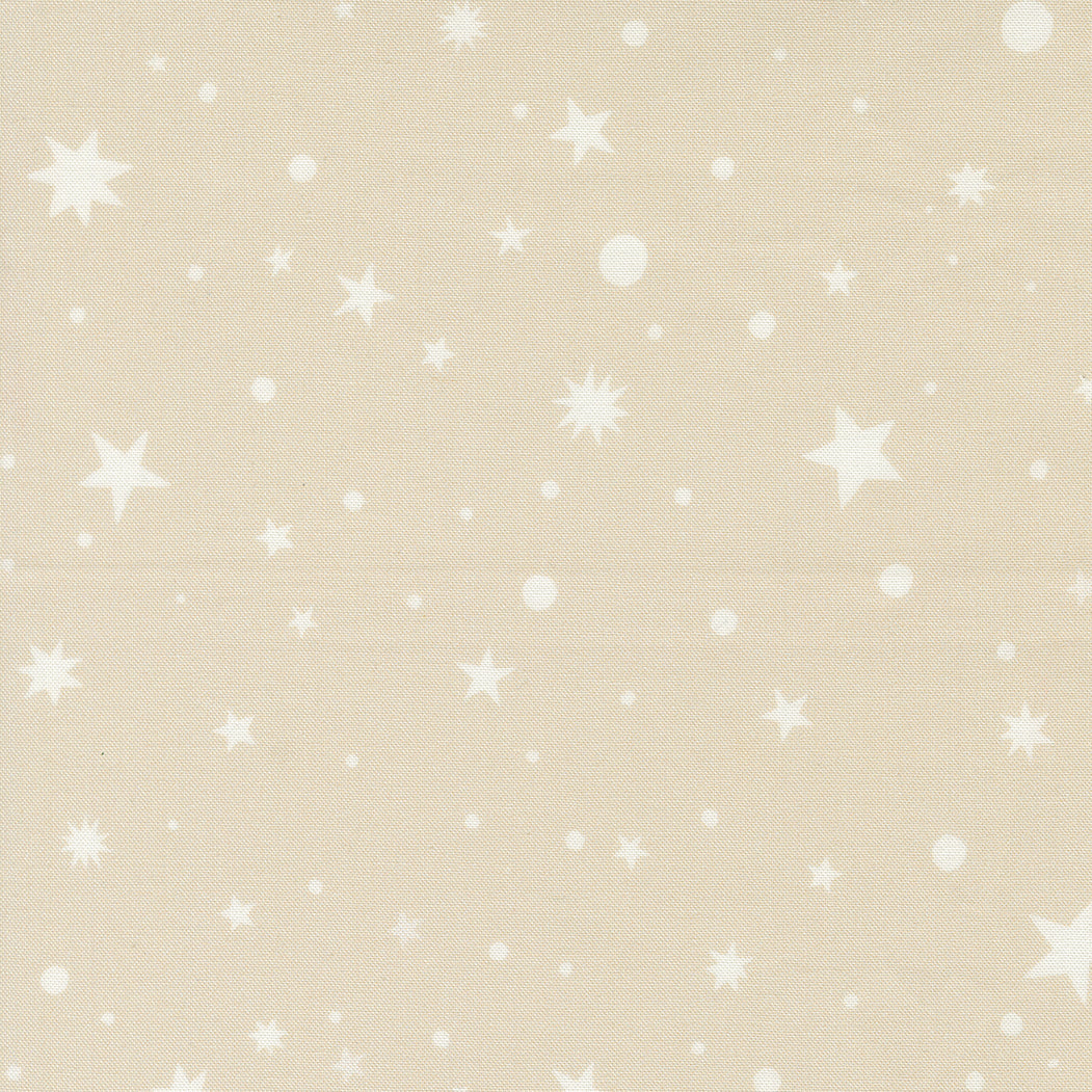 fabric swatch with various sizes of stars, starbursts, and dots in soft white, on a soft taupe background