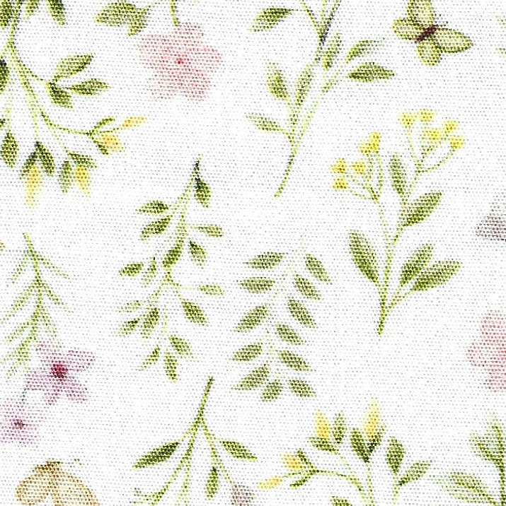 A fabric featuring a variety of pink, green, and yellow floral prints with butterflies on a white background.