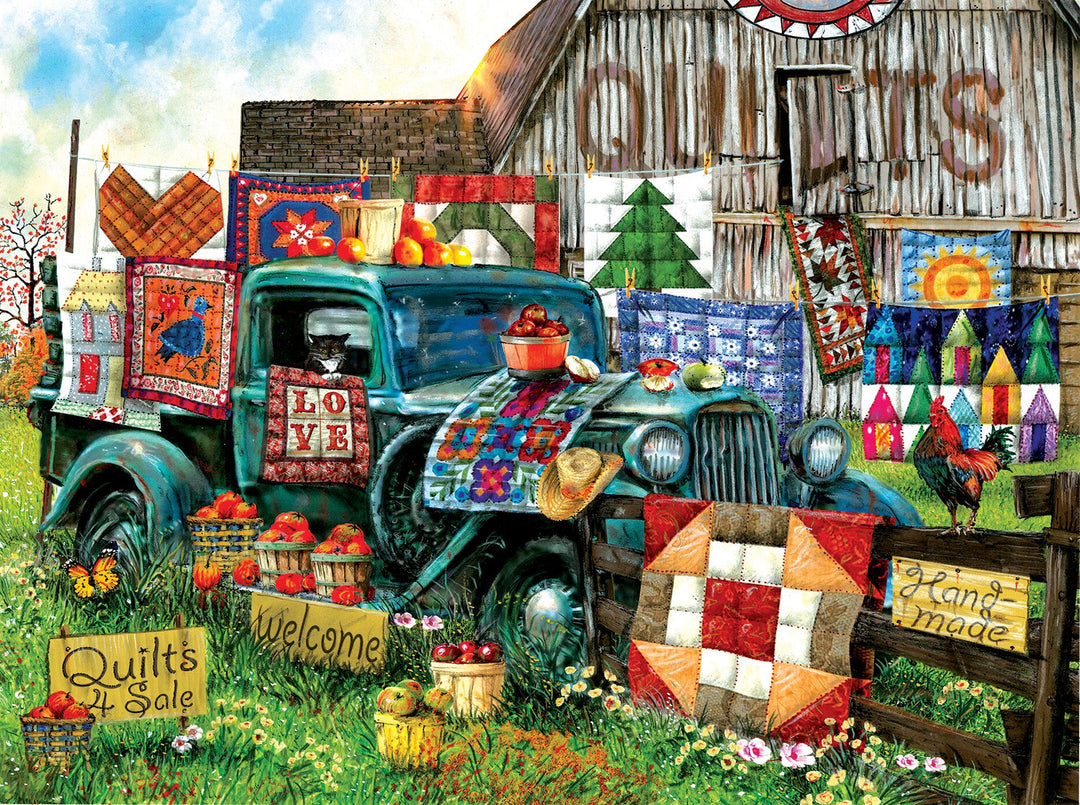 Quilts for sale image of quilts hanging in front of a barn and an old truck display