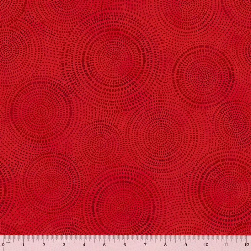 fabric swatch featuring circles within circles made up of small dark red marks all on a Christmas red background