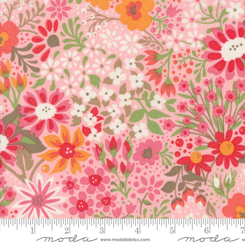 Pink background with colorful spring flowers