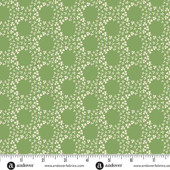 Green fabric with clovers in a circle