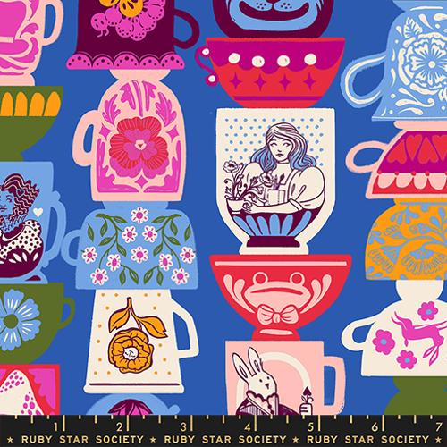 columns of stacked teacups, some upside down and some right side up, featuring various Alice in Wonderland themed designs in bright colors, on a blue background