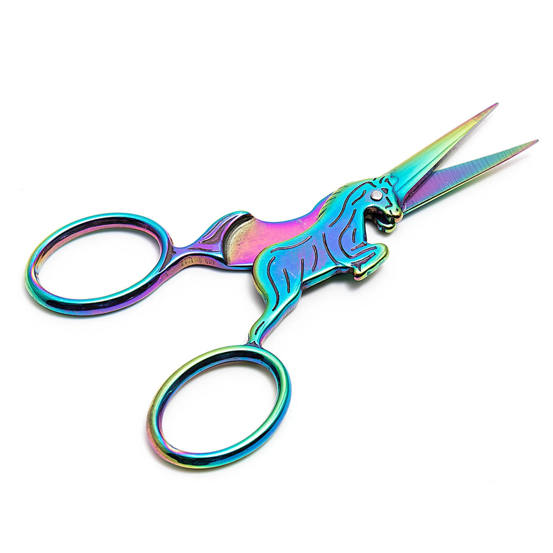 Colorful unicorn-shaped scissors on a white background