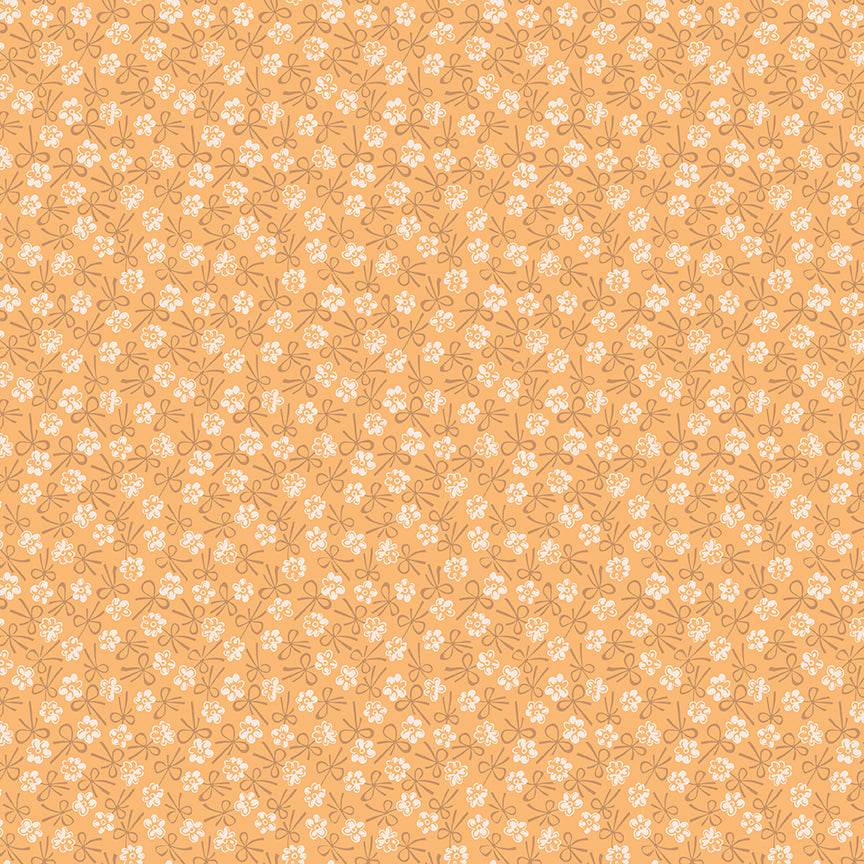 This print features blossoms and bows in Marigold