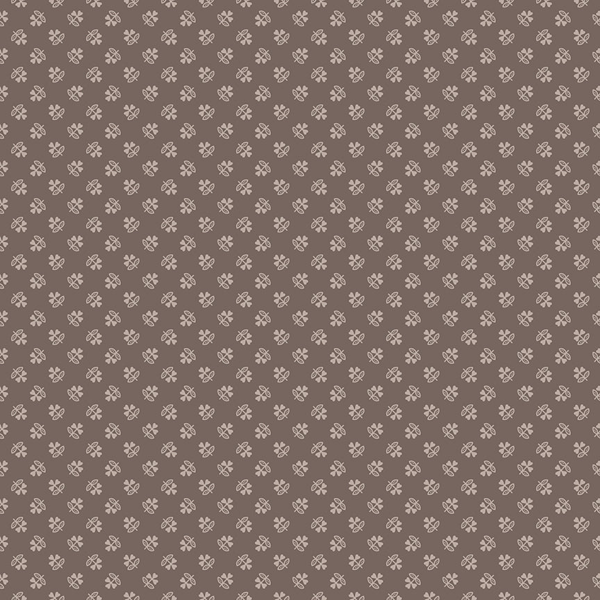 This print features an array of clovers in a grey/brown color way