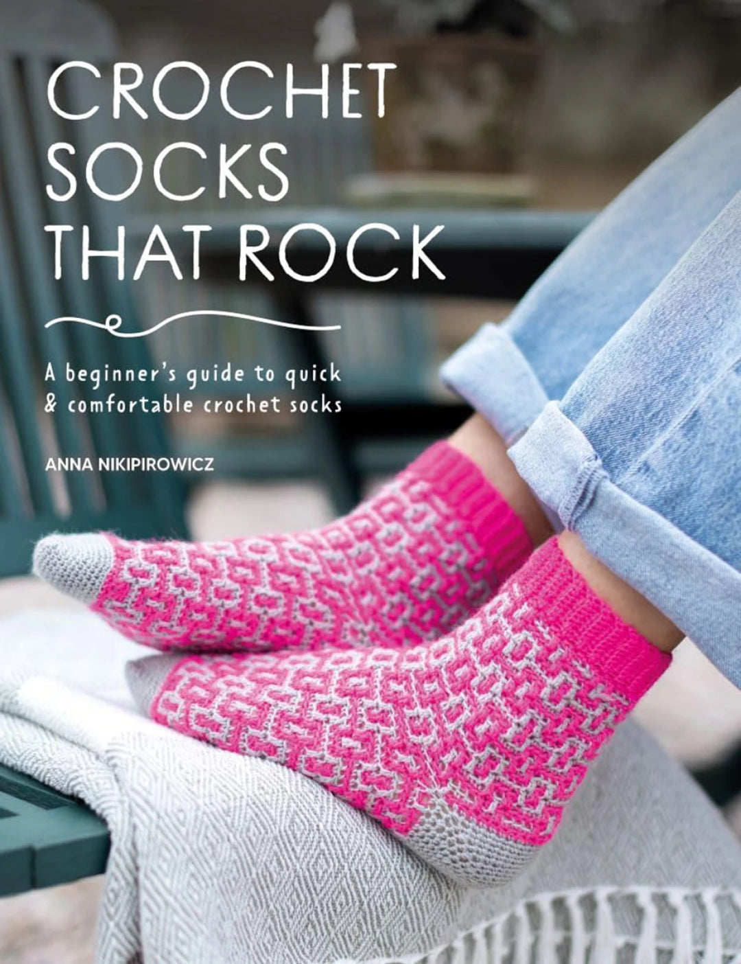 Book cover of 'Crochet Socks That Rock' by Anna Nikipirovicz featuring pink crochet socks.