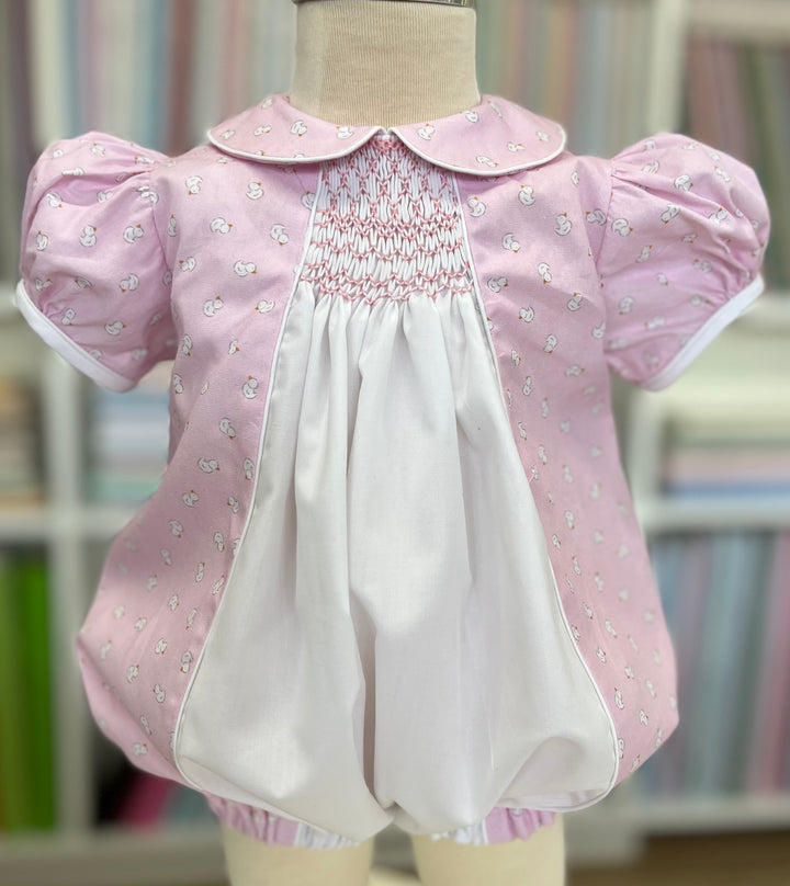 smocked bubble outfit in pink with white ducks
