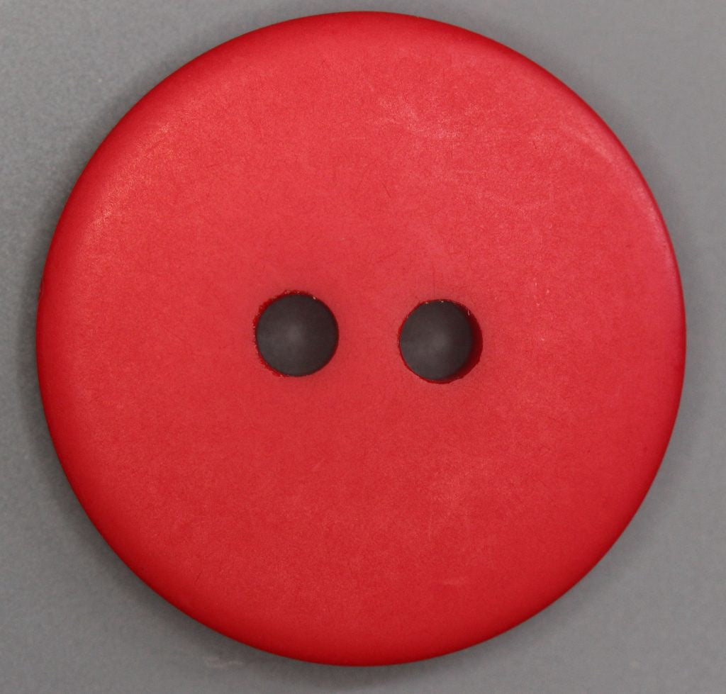 A red, solid-colored round button with two holes.
