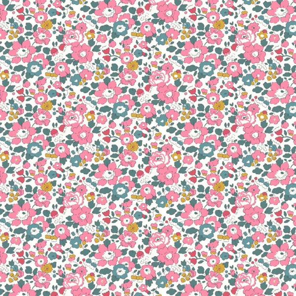 Medium pink floral with blue green leaves accented with mustard colored flowers.