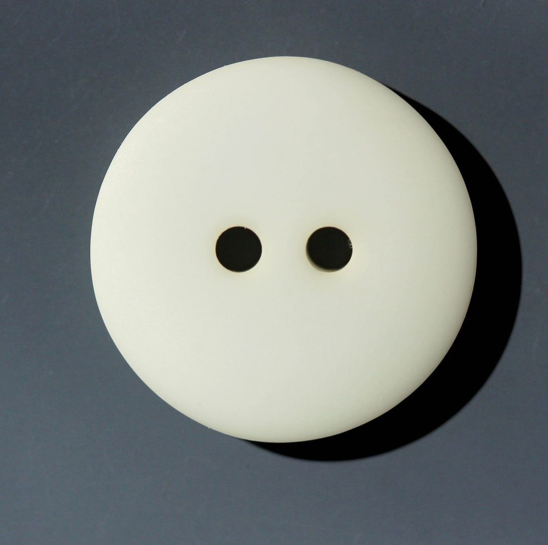 White button on a dark gray background