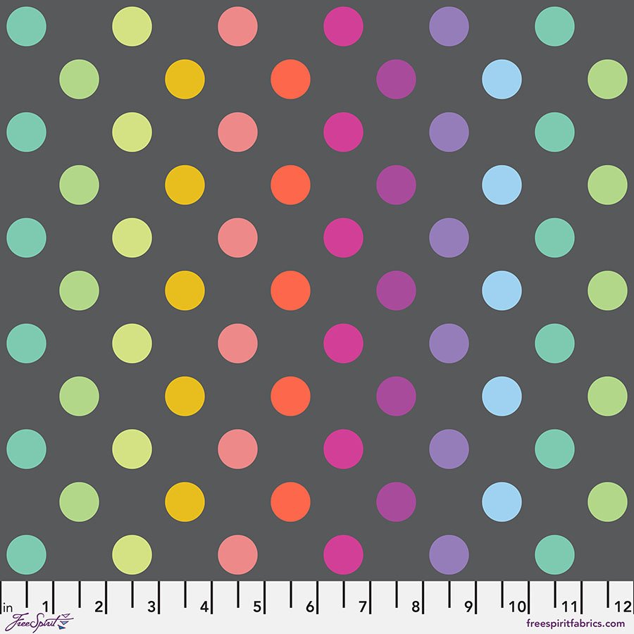 fabric swatch with dark gray background and rainbow gradient dots