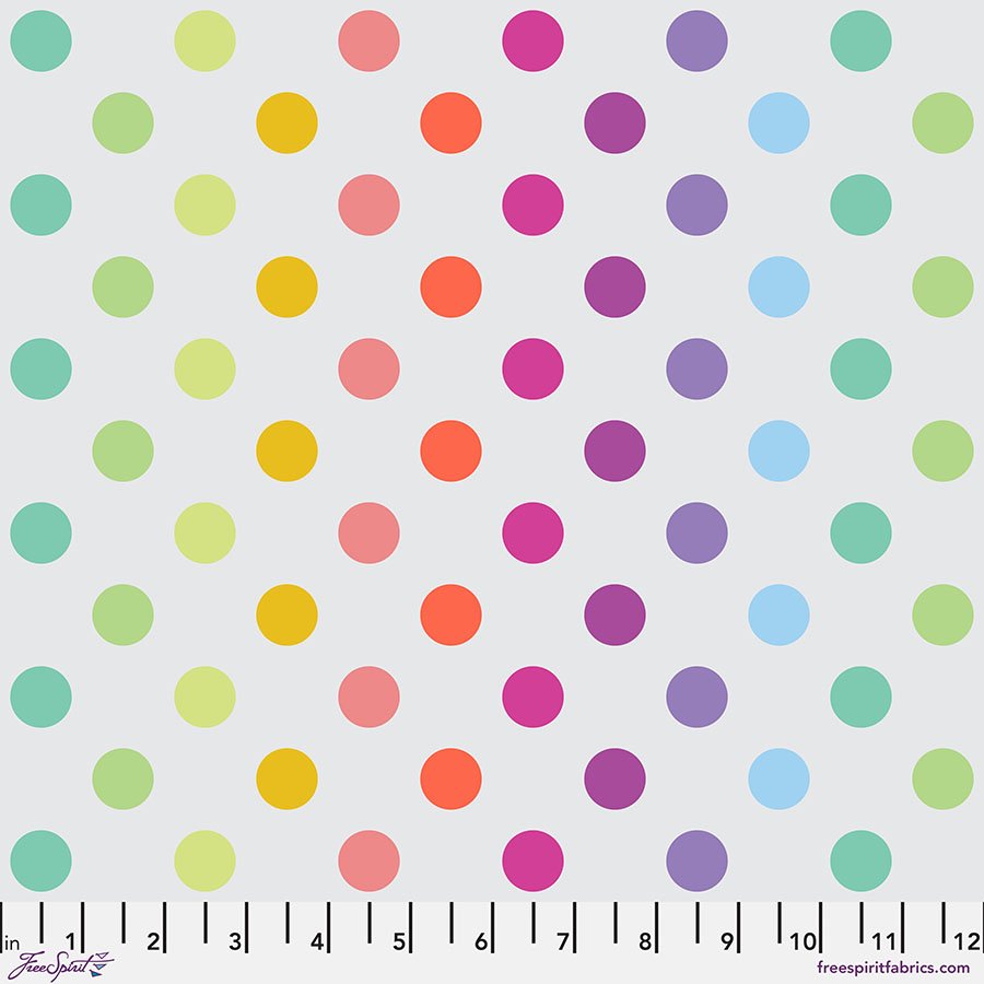 fabric swatch with light gray background and rainbow gradient geometric dots