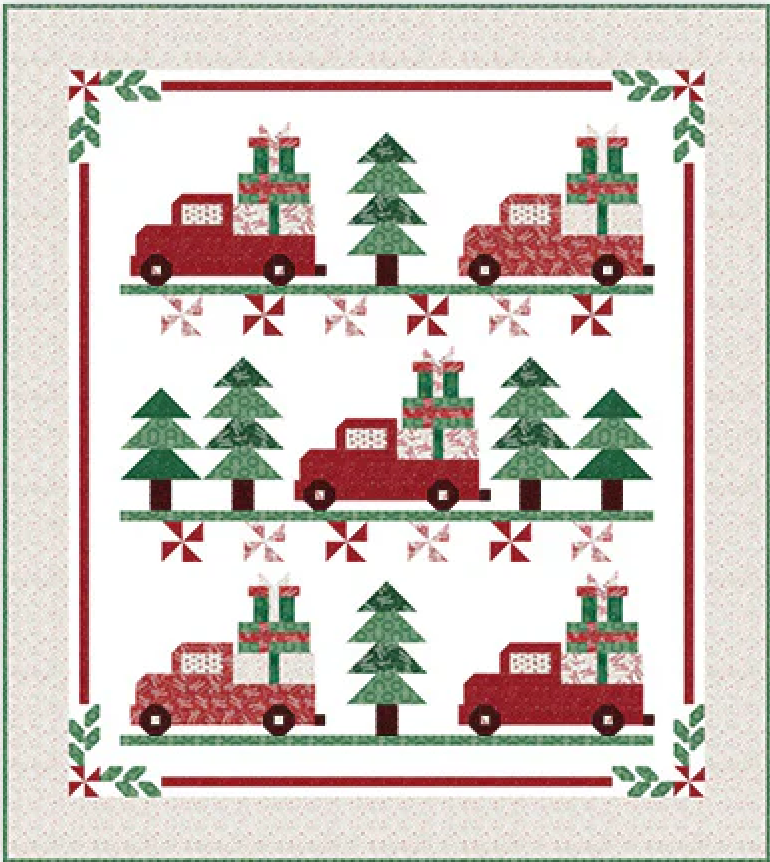 quilt featuring red trucks with Christmas presents and pine trees