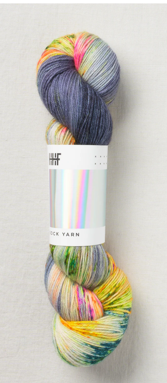 Sock yarn with yellow, blue, pink, green, and creams