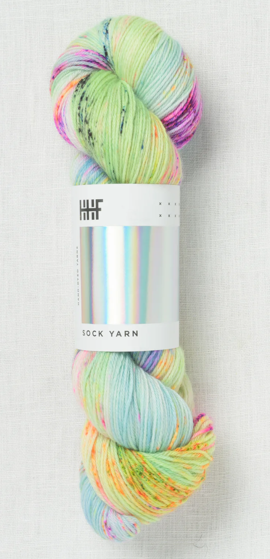 Sock yarn with bright blue, green, yellow, and pinks