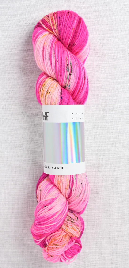 Sock yarn with bright pink and hints of yellow