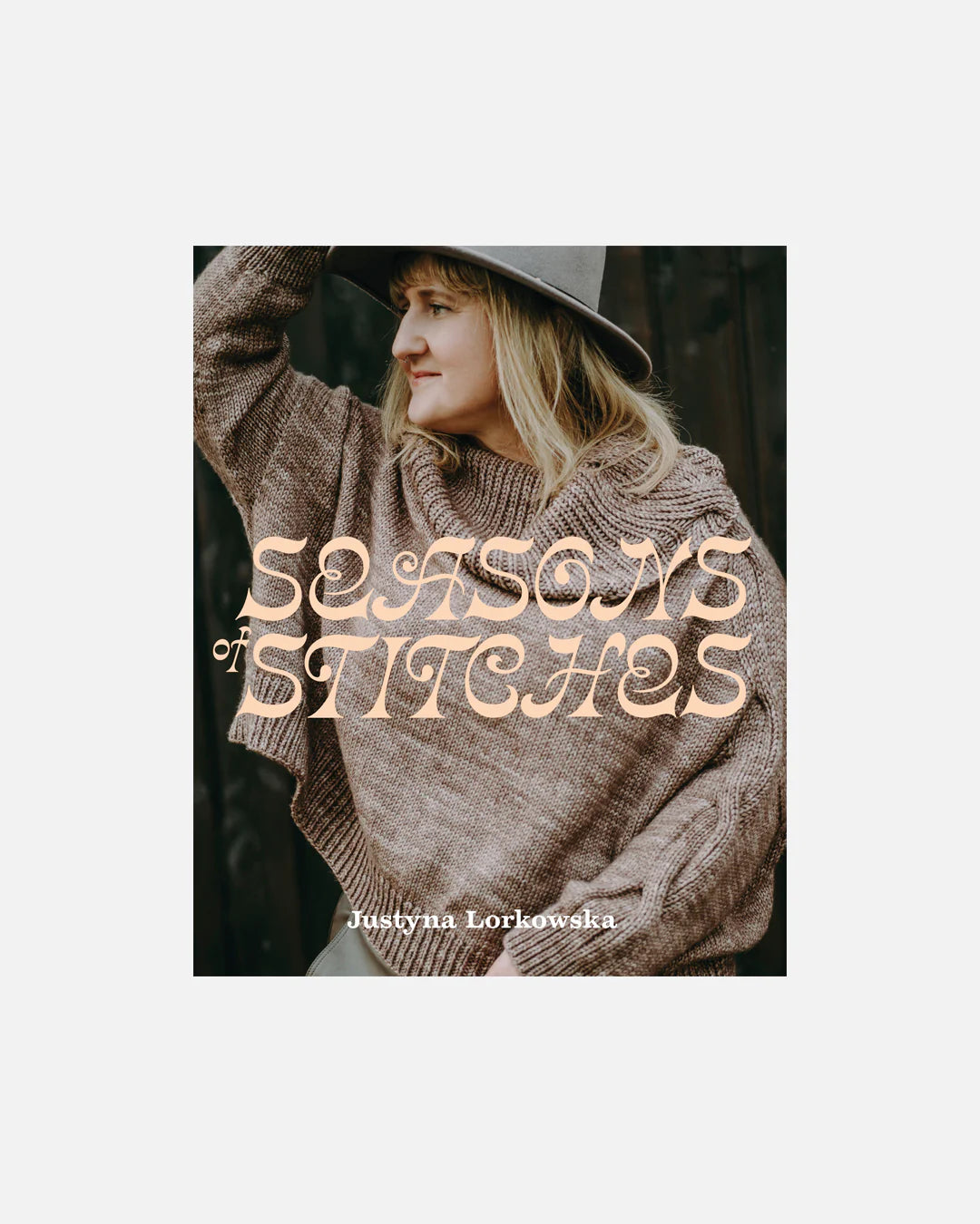 Book cover of 'Seasons of Stitches' by Justyna Lorkowska with a person wearing a knitted sweater and hat.