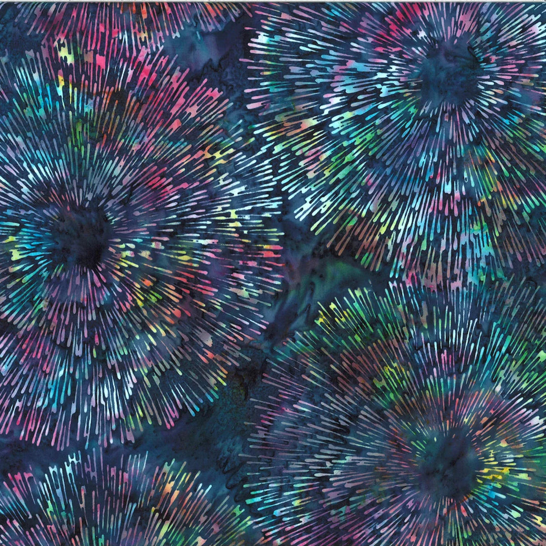 Colorful abstract pattern resembling fireworks on a dark background
