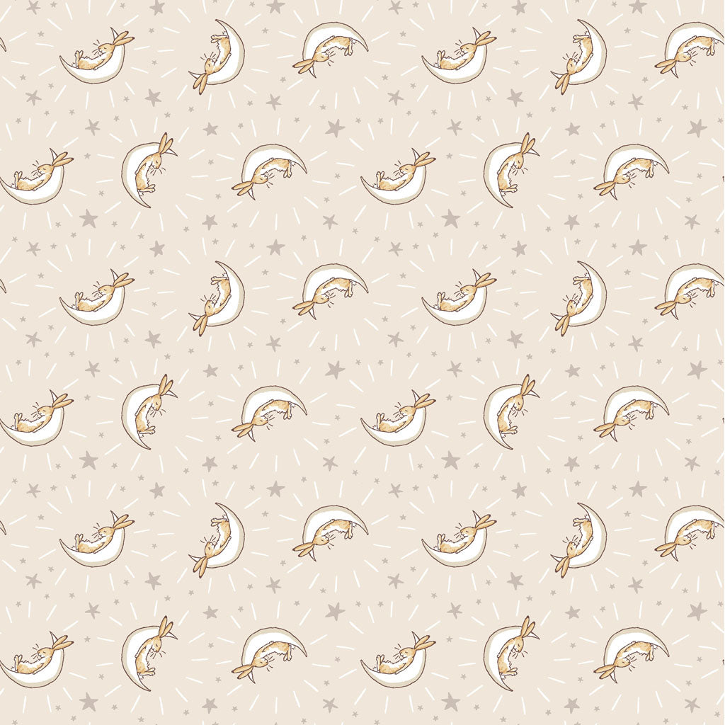 khaki fabric covered with white half moons and bunnies