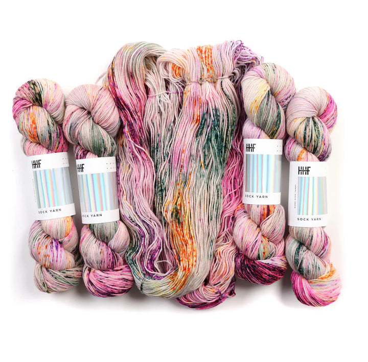 Sock yarn with hints of pink, green, and oranges.