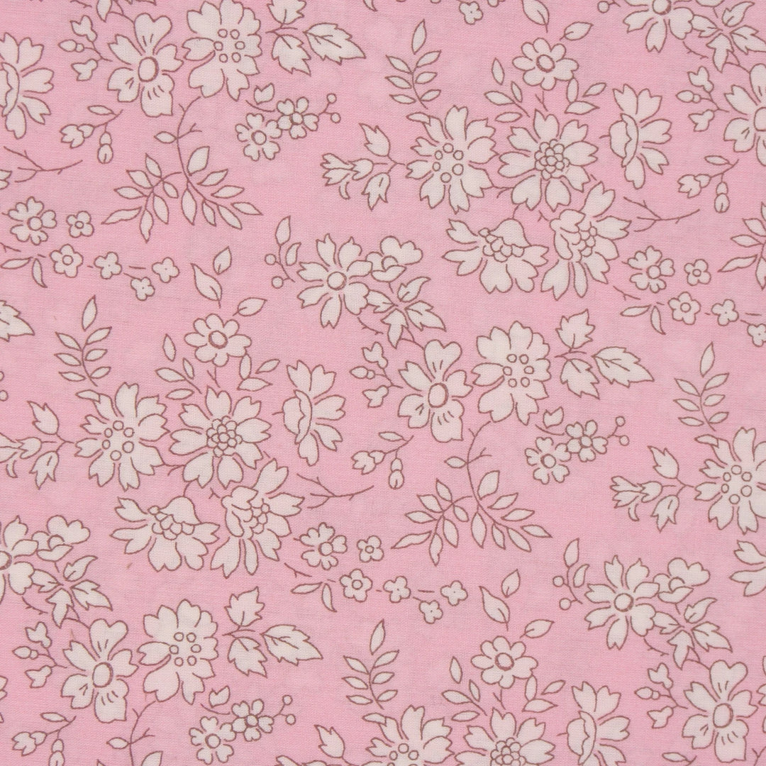 pink fabric with cream flowers