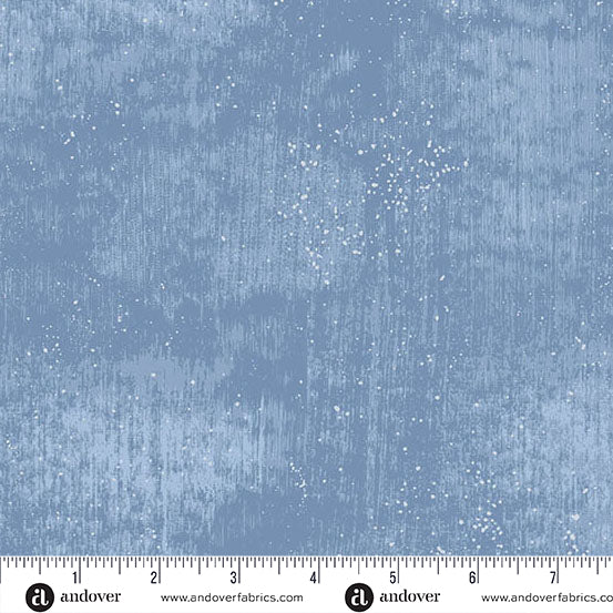 Blue fabric with a distressed look and scattered white dots