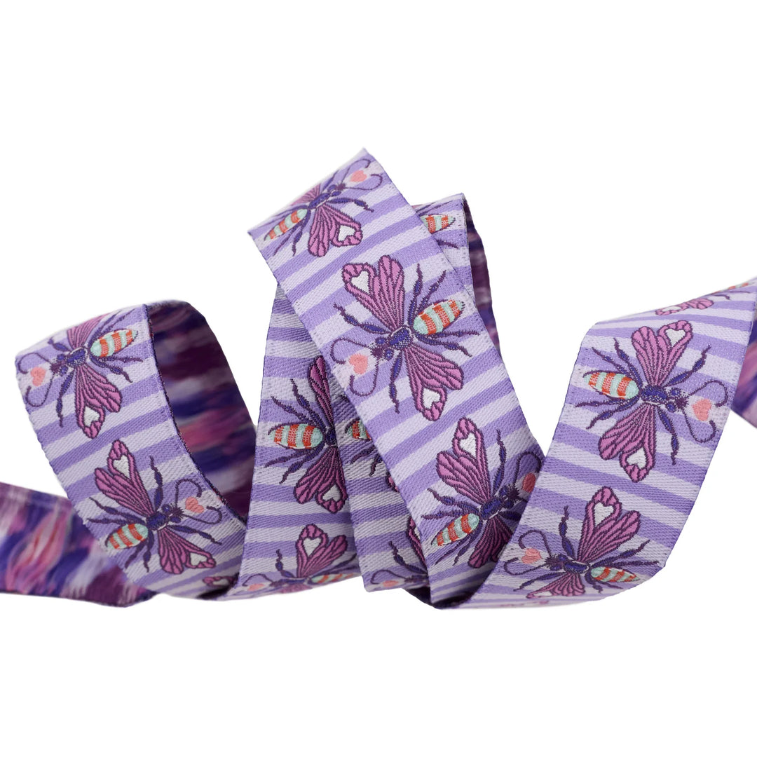 light and dark purple striped ribbon with purple bee design