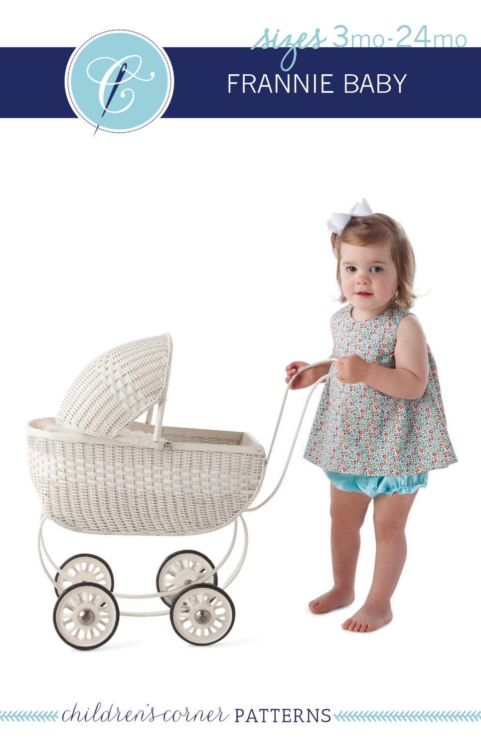 A young child wearing a swing sundress standing next to a baby stroller. The dress appears to be floral and the child is wearing a solid color bloomers.