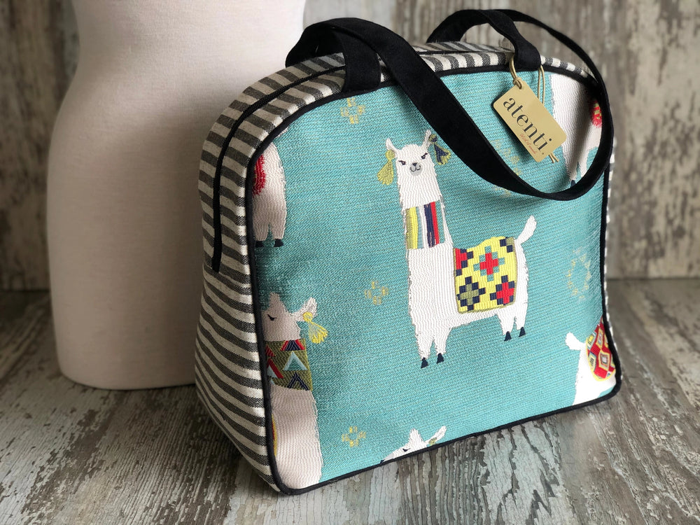 Bag with llama design on a wooden surface