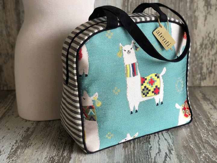 Bag with llama design on a wooden surface
