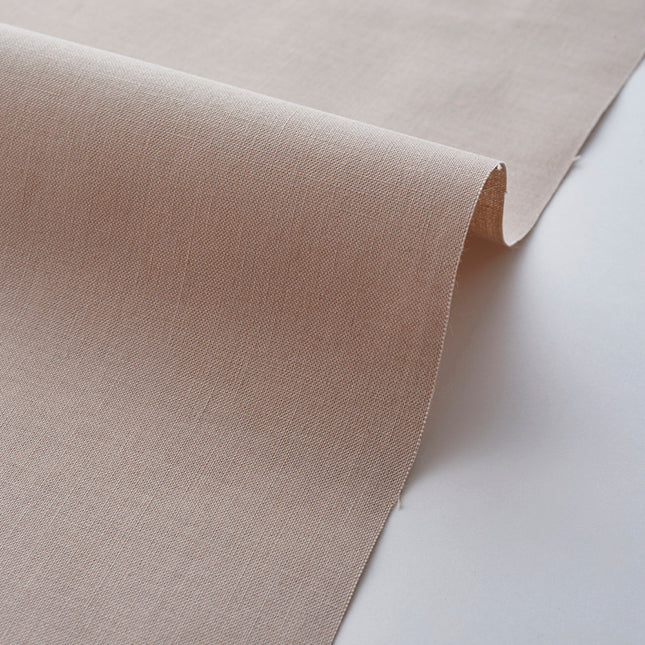 Beige fabric roll on a white background