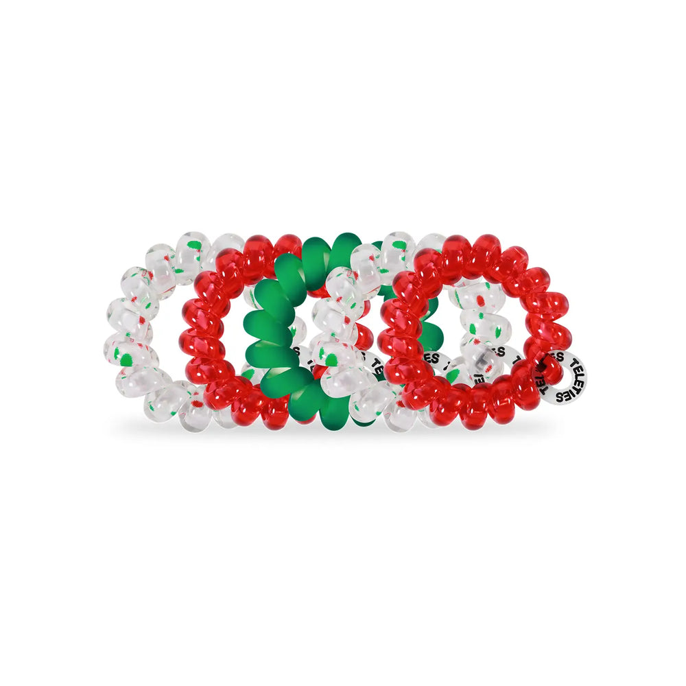 Three beaded hair bands in red, green, and clear on a white background