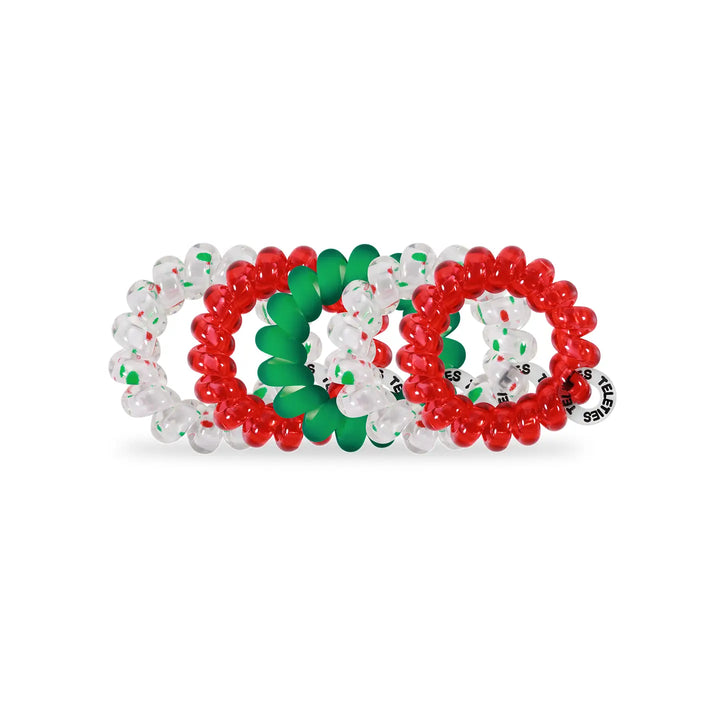 Three beaded hair bands in red, green, and clear on a white background