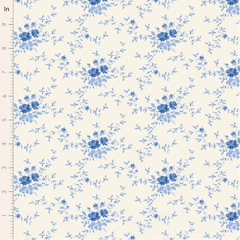 Blue floral pattern on a white fabric with a ruler for scale.