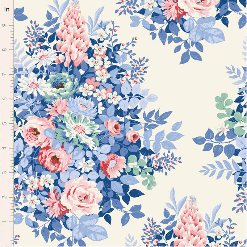 Floral fabric pattern with pink and blue flowers on a white background, measured against a ruler.