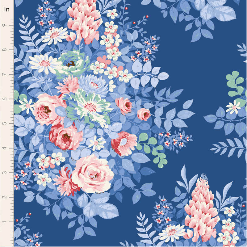 Floral fabric pattern with pink and white flowers on a blue background, measured against a ruler.