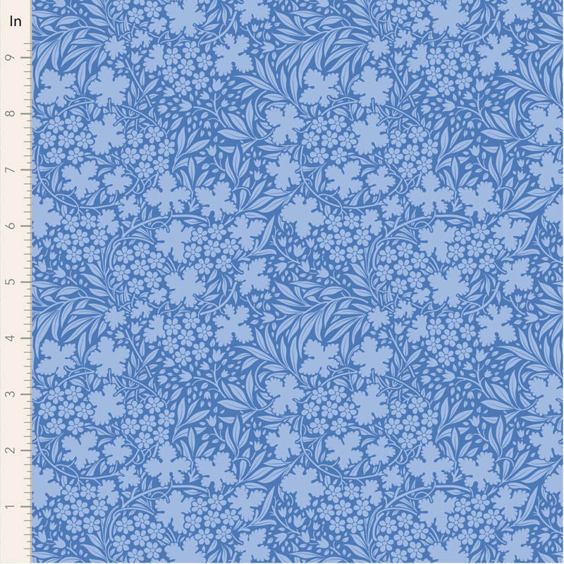 Floral patterned fabric with blue flowers on a blue background