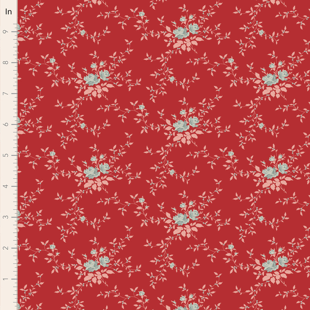 Floral pattern on a red fabric with a ruler for scale