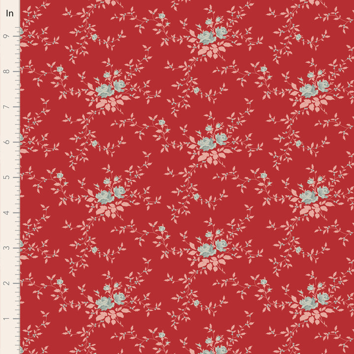 Floral pattern on a red fabric with a ruler for scale