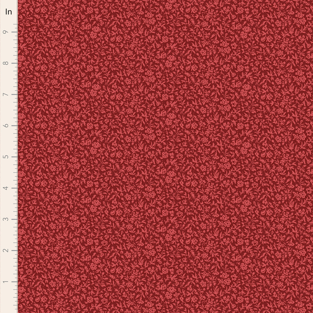 Red fabric with a subtle pattern on a scale ruler background