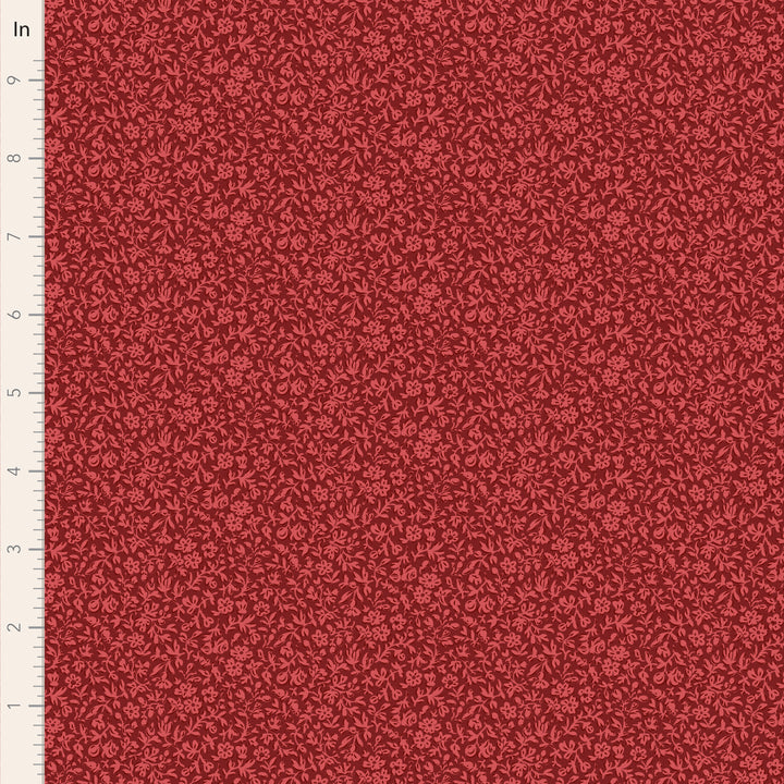 Red fabric with a subtle pattern on a scale ruler background