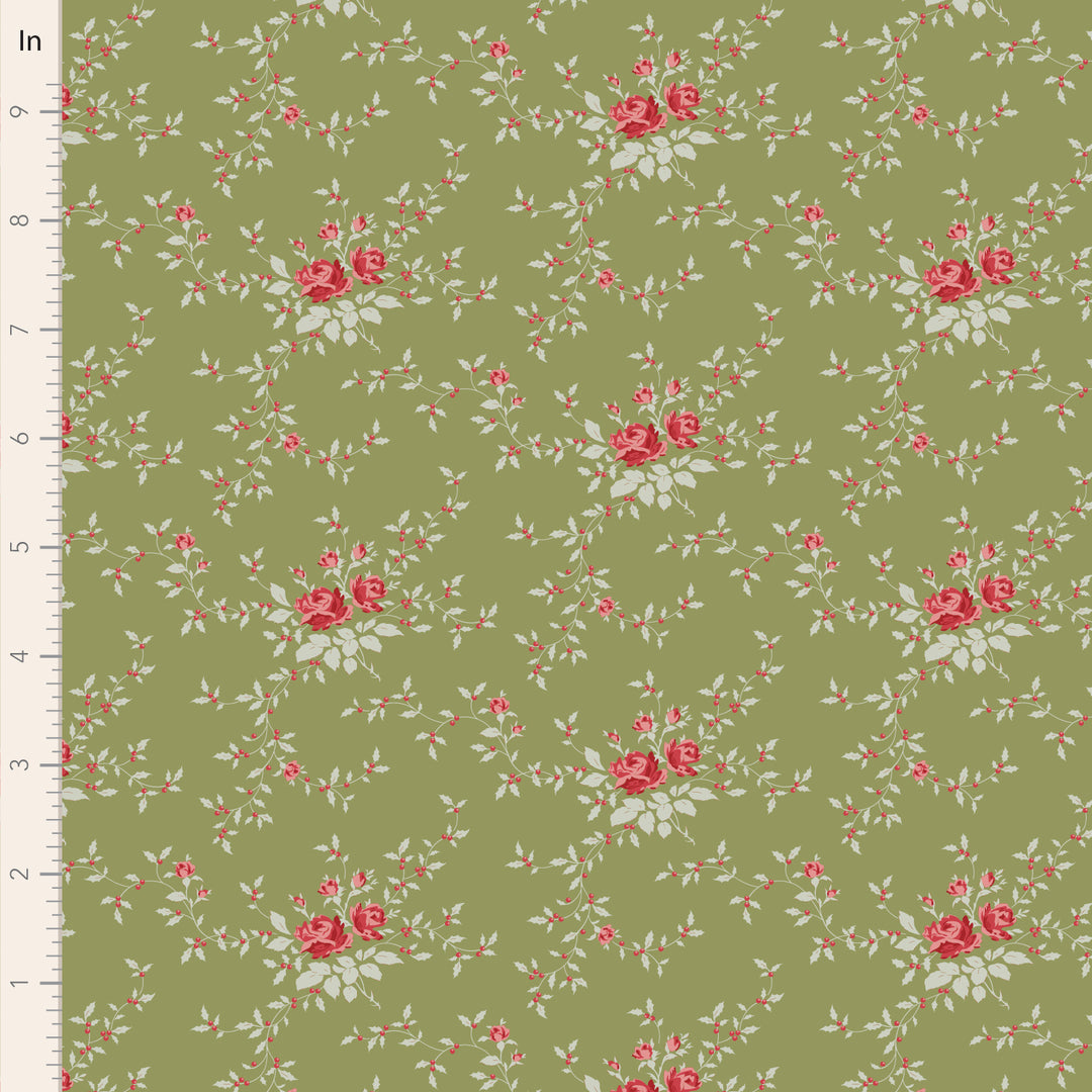 Floral pattern with red roses and green leaves on a green background, measured against a ruler.