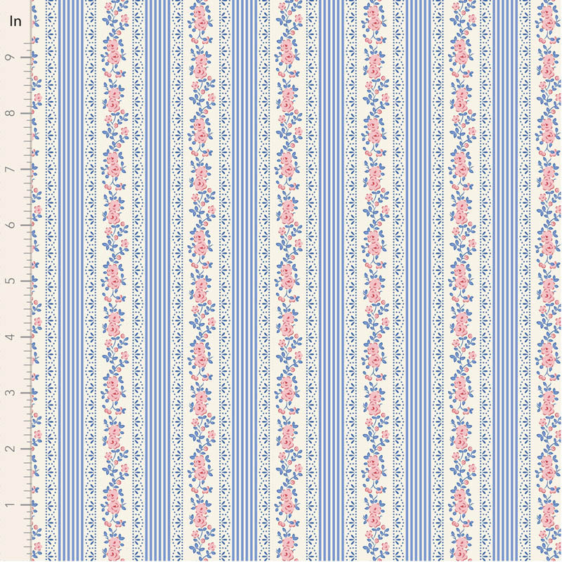 Striped fabric pattern with floral designs on a ruler for scale.