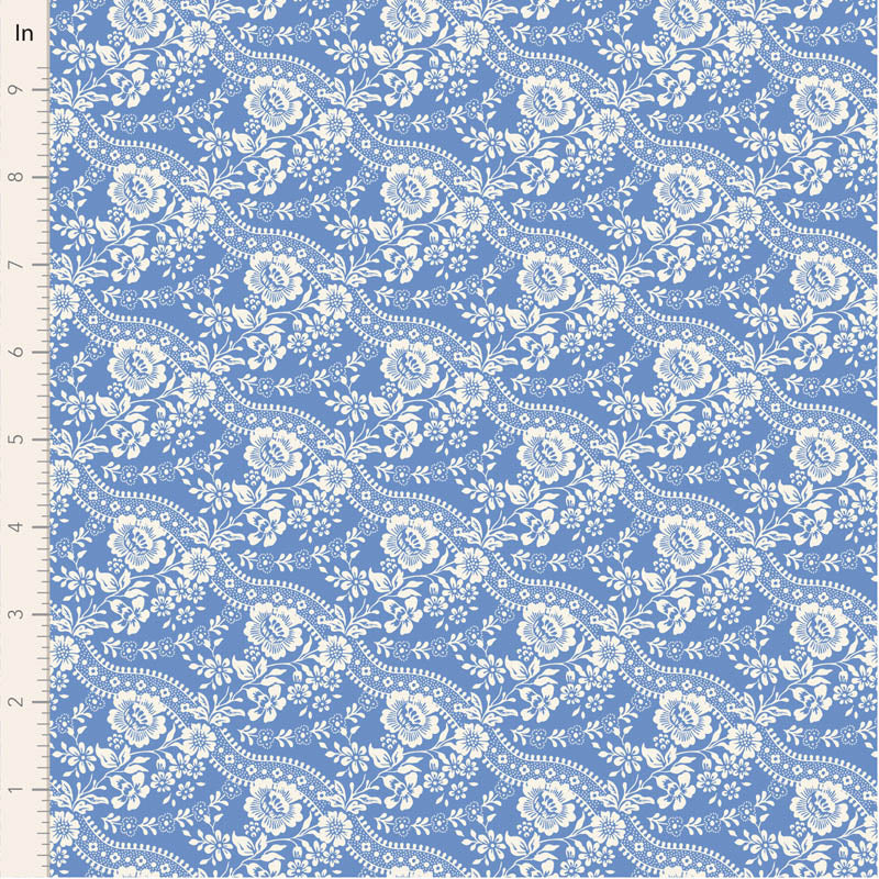 White floral pattern on a blue fabric swatch