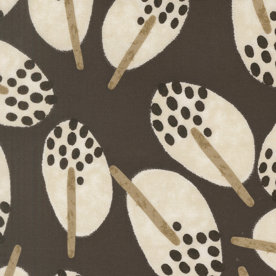 Patterned fabric with abstract shapes on a dark background