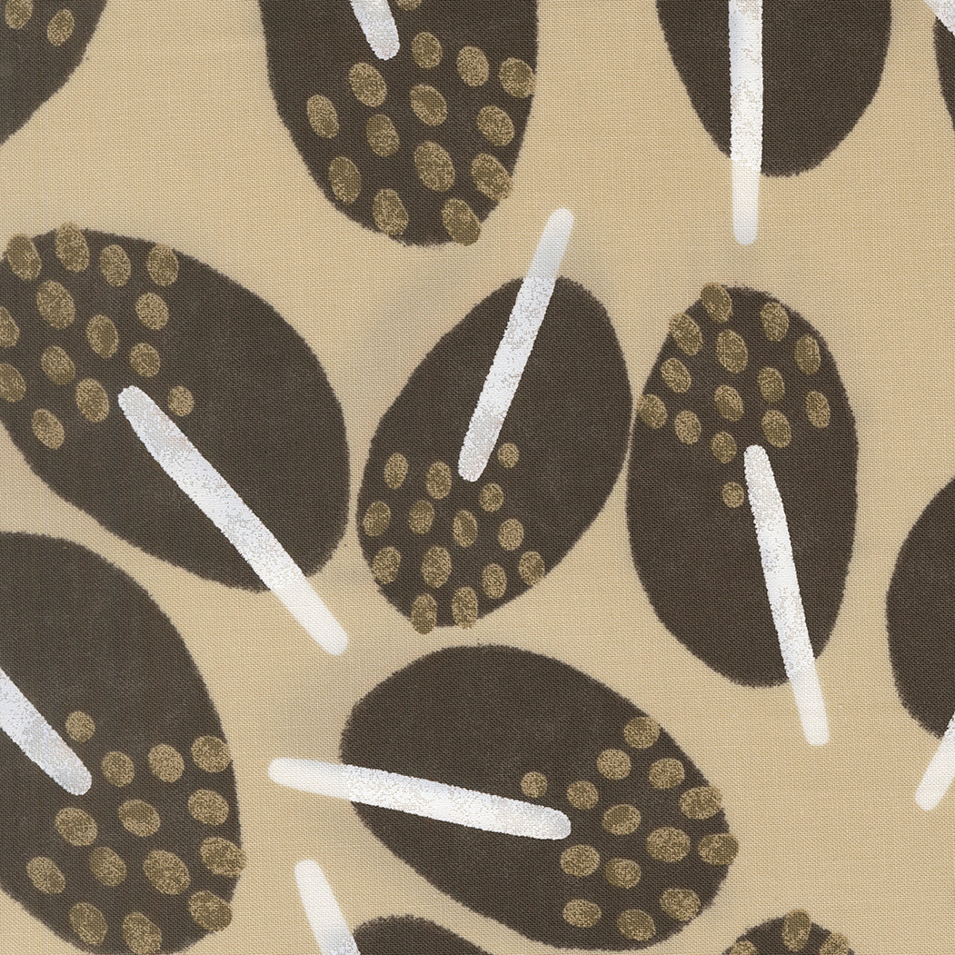 Pattern of black and gold shapes on a beige background