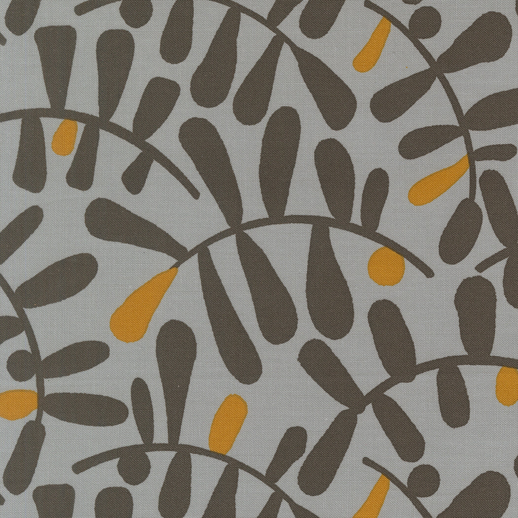 Patterned fabric with black and yellow shapes on a gray background